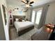 Bedroom featuring a custom Peter Pan mural, hardwood flooring, and lots of natural light at 384 Summer Squall Rd, Davenport, FL 33837