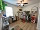 A fun bedroom featuring a desk, a playhouse, and a creative tree accent at 384 Summer Squall Rd, Davenport, FL 33837