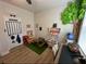 A whimsical bedroom includes a playhouse, market, and decorative tree at 384 Summer Squall Rd, Davenport, FL 33837