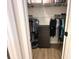 Walk-in closet with custom shelving and hanging rods at 384 Summer Squall Rd, Davenport, FL 33837