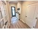 Cozy entryway featuring a stylish console table, decorative accents, and ample natural light at 384 Summer Squall Rd, Davenport, FL 33837
