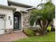 Charming home featuring a stone facade, manicured landscaping, and a welcoming entrance at 384 Summer Squall Rd, Davenport, FL 33837