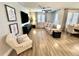 Open concept living room with hardwood floors, neutral color palette and lots of light at 384 Summer Squall Rd, Davenport, FL 33837