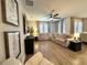 Open concept living room with hardwood floors, neutral color palette and lots of light at 384 Summer Squall Rd, Davenport, FL 33837