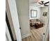 Cozy sitting room with a floral sofa, wooden floors, and a ceiling fan, perfect for relaxing at 384 Summer Squall Rd, Davenport, FL 33837