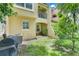 A quaint backyard patio space with outdoor seating and lush green grass at 4814 Luge Ln, Orlando, FL 32839