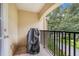Private balcony with metal railing, perfect for enjoying outdoor views, and includes a grill at 4814 Luge Ln, Orlando, FL 32839