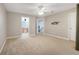 Spacious bedroom with neutral walls, carpet, and ensuite bathroom access at 4814 Luge Ln, Orlando, FL 32839