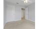 Bedroom featuring neutral carpet, closet, and a ceiling fan at 4814 Luge Ln, Orlando, FL 32839