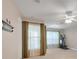 Versatile bonus room with exercise equipment, neutral walls, and natural light at 4814 Luge Ln, Orlando, FL 32839