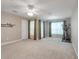 Versatile bonus room with exercise equipment, neutral walls, and natural light at 4814 Luge Ln, Orlando, FL 32839