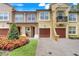 Charming townhomes with beautiful landscaping, garages, and brick paver driveways in a well-maintained community at 4814 Luge Ln, Orlando, FL 32839
