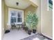 Inviting front porch with seating area and decorative plants for a relaxing outdoor space at 4814 Luge Ln, Orlando, FL 32839