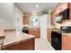 Well-equipped kitchen with black appliances, wood cabinets, and tile flooring at 4814 Luge Ln, Orlando, FL 32839