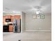 Open-concept kitchen area with modern stainless steel appliances and sleek cabinetry at 4814 Luge Ln, Orlando, FL 32839