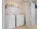 A laundry room with a full sized washer and dryer at 4814 Luge Ln, Orlando, FL 32839