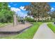 Well-maintained community playground with climbing structure and green space for outdoor fun at 4814 Luge Ln, Orlando, FL 32839