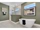Beautiful bathroom featuring a standalone tub, walk-in shower, and modern fixtures at 5177 Blanket Flower St, Apopka, FL 32712