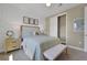 Bedroom featuring a queen-size bed, neutral decor, and a closet, illuminated by a ceiling fan at 5177 Blanket Flower St, Apopka, FL 32712