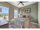 Bright bedroom with two windows and light, neutral decor at 5177 Blanket Flower St, Apopka, FL 32712