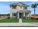 Charming two-story home featuring a well-manicured lawn and eye-catching turquoise shutters at 5177 Blanket Flower St, Apopka, FL 32712