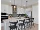 Kitchen with stainless steel appliances, a large island, and pendant lights overhanging the breakfast bar at 5177 Blanket Flower St, Apopka, FL 32712