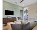 Comfortable living area features modern furnishings and a view into the next room at 5177 Blanket Flower St, Apopka, FL 32712