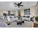 Spacious living room featuring modern decor, comfortable seating, and an open floor plan at 5177 Blanket Flower St, Apopka, FL 32712