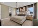 Elegant main bedroom with large windows, tasteful décor, and a serene atmosphere at 5177 Blanket Flower St, Apopka, FL 32712
