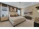 Luxurious main bedroom featuring a beautiful chandelier, stylish furnishings, and neutral décor at 5177 Blanket Flower St, Apopka, FL 32712