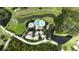 Aerial view of a clubhouse, swimming pool, and surrounding community area at 651 Timbercrest Dr, Leesburg, FL 34748