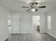 Bright bedroom with ceiling fan and neutral paint at 651 Timbercrest Dr, Leesburg, FL 34748
