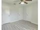 A bedroom with light gray floors and white walls and doors at 651 Timbercrest Dr, Leesburg, FL 34748
