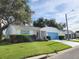 Single-story home featuring a well-kept lawn, shade tree, and a driveway leading to the attached garage at 651 Timbercrest Dr, Leesburg, FL 34748