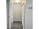 Hallway features luxury vinyl plank flooring and multiple closets at 651 Timbercrest Dr, Leesburg, FL 34748