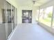 Enclosed lanai with sliding glass doors at 651 Timbercrest Dr, Leesburg, FL 34748