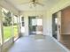 Enclosed lanai with ceiling fan and sliding glass doors at 651 Timbercrest Dr, Leesburg, FL 34748