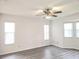 Airy room with ceiling fan and many windows at 651 Timbercrest Dr, Leesburg, FL 34748