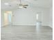 Spacious living area boasts sleek flooring, neutral tones, and versatile layout for modern living at 651 Timbercrest Dr, Leesburg, FL 34748