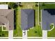 Aerial view of house showing well-manicured backyard, driveway, and neighboring homes at 7732 Sloewood Dr, Leesburg, FL 34748