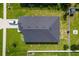 Aerial top-down view of the home's roof, backyard, and nearby neighborhood at 7732 Sloewood Dr, Leesburg, FL 34748