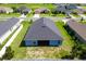 Aerial view of home, showing backyard and screen patio at 7732 Sloewood Dr, Leesburg, FL 34748