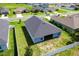 Bird's eye view of the house showing the roof, backyard and surrounding neighborhood at 7732 Sloewood Dr, Leesburg, FL 34748
