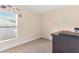 This is a simple bedroom with neutral paint, carpet and decor on the walls at 7732 Sloewood Dr, Leesburg, FL 34748