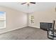 This is a simple bedroom with neutral paint, carpet and a ceiling fan at 7732 Sloewood Dr, Leesburg, FL 34748