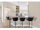 Bright kitchen showcasing granite counters, stainless appliances and breakfast bar with seating for four at 7732 Sloewood Dr, Leesburg, FL 34748