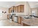 Well-equipped kitchen has granite countertops, stainless appliances, and ample cabinetry at 7732 Sloewood Dr, Leesburg, FL 34748
