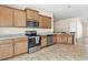 Beautiful kitchen features modern appliances, granite countertops and wood cabinetry at 7732 Sloewood Dr, Leesburg, FL 34748