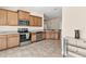 Open kitchen boasts stainless appliances, lots of counter space, and access to a dining area at 7732 Sloewood Dr, Leesburg, FL 34748