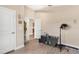 Large room with gray wood-look floors and neutral walls, with a modern black salon hair dryer at 7732 Sloewood Dr, Leesburg, FL 34748